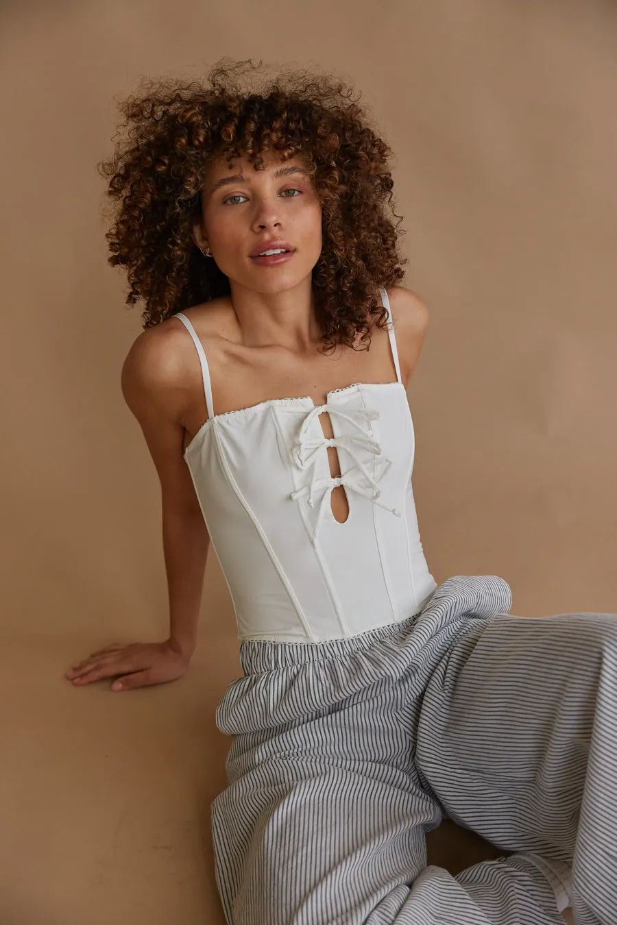Amelie Eyelet Trim Bow Corset Top air move