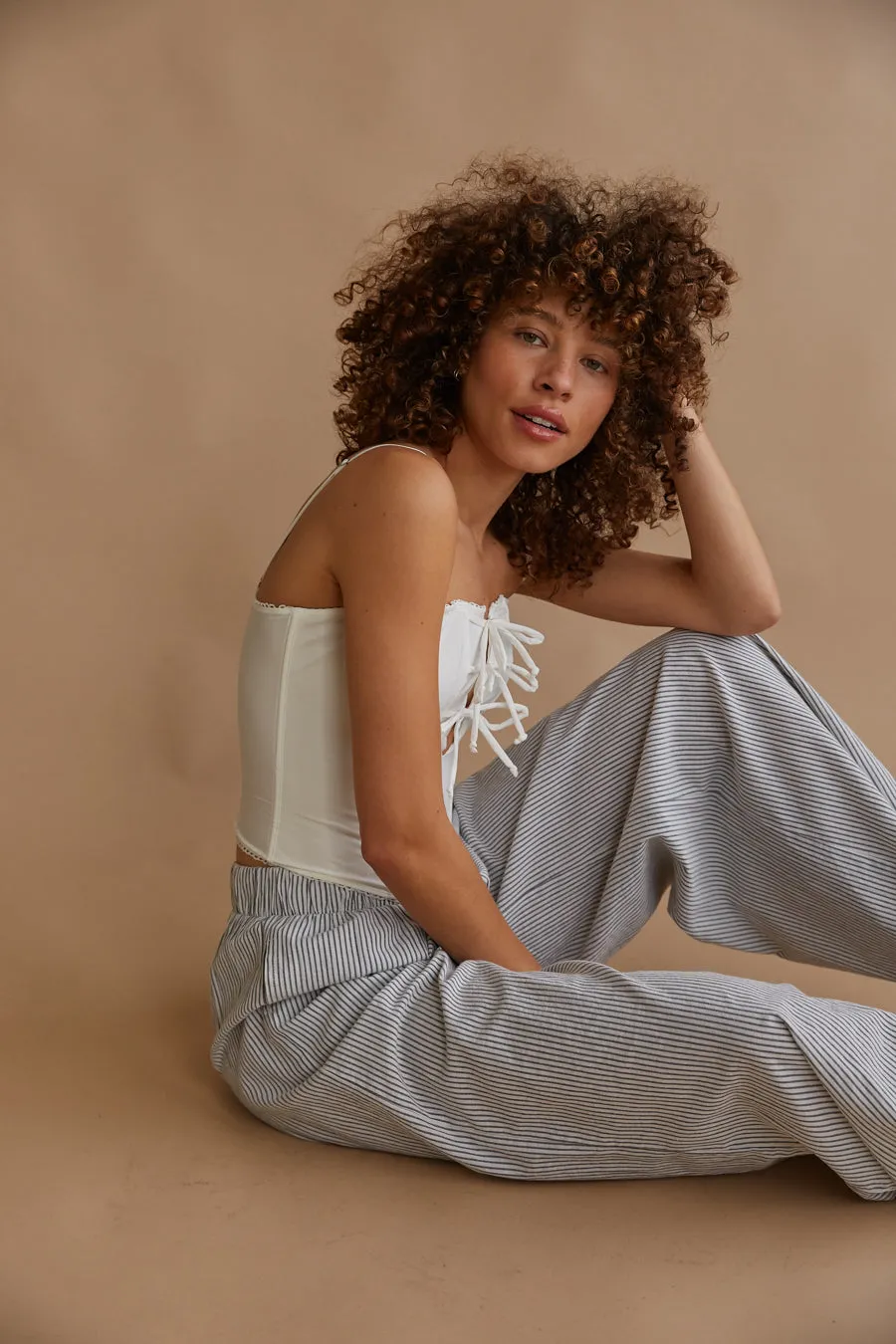 Amelie Eyelet Trim Bow Corset Top air move