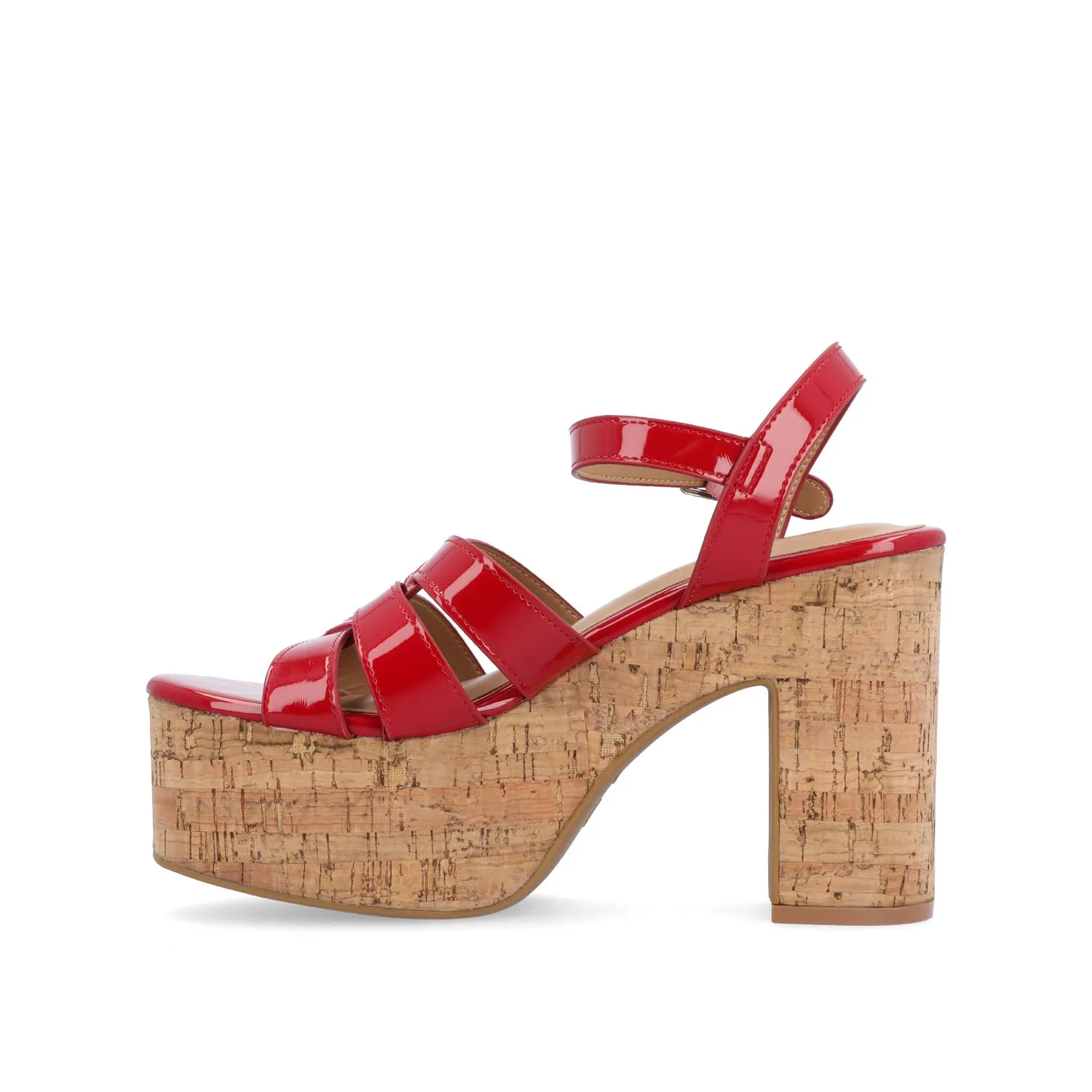 JANIA BLOCK HEELED SANDALS IN PATENT travel light