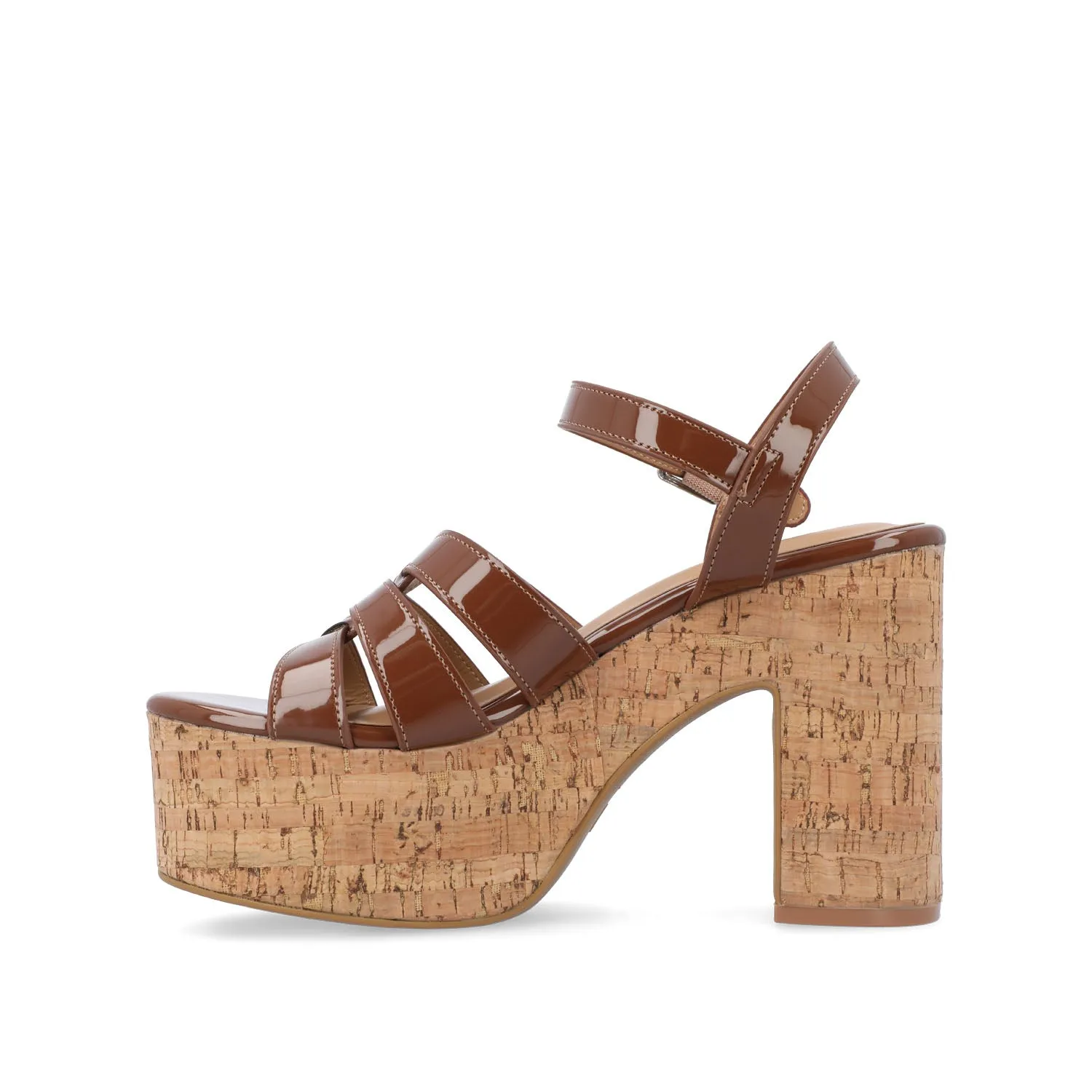 JANIA BLOCK HEELED SANDALS IN PATENT travel light