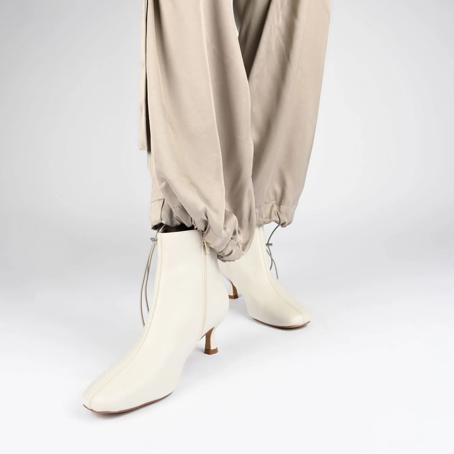 KELSSA POINTED TOE BOOTIES IN FAUX LEATHER snow charm