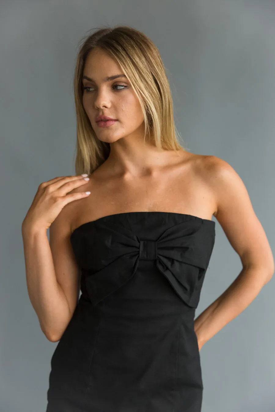 Mina Strapless Bow Bodycon Mini Dress pose chic